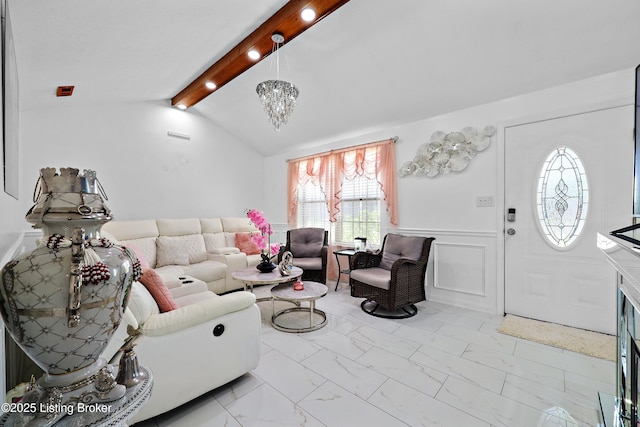 living area with wainscoting, lofted ceiling with beams, a notable chandelier, and marble finish floor