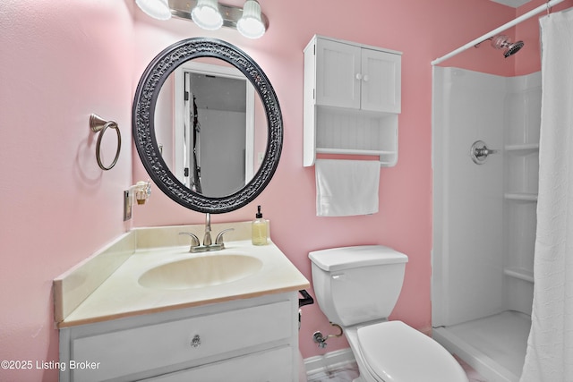 full bathroom featuring vanity, toilet, and a stall shower