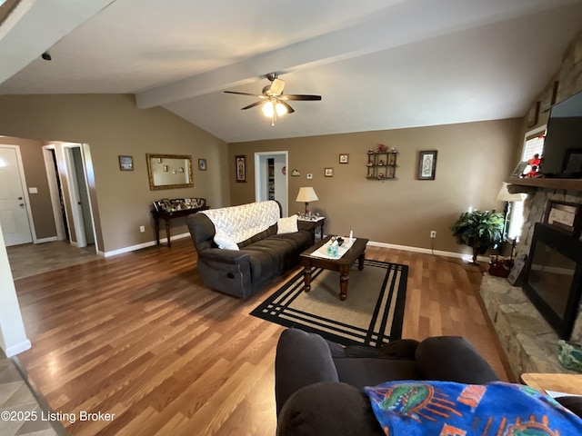 154 Gossom Ln, Milton, KY 40045 - living room featuring wood finished floors, vaulted ceiling with beams, a ceiling fan, baseboards, and a fireplace