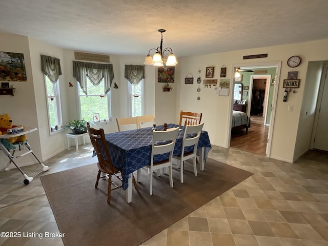 154 Gossom Ln, Milton, KY 40045 - dining area with baseboards, a chandelier, and tile patterned floors