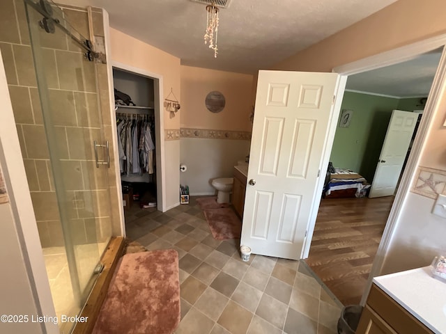 154 Gossom Ln, Milton, KY 40045 - full bath featuring a spacious closet, toilet, vanity, and a stall shower