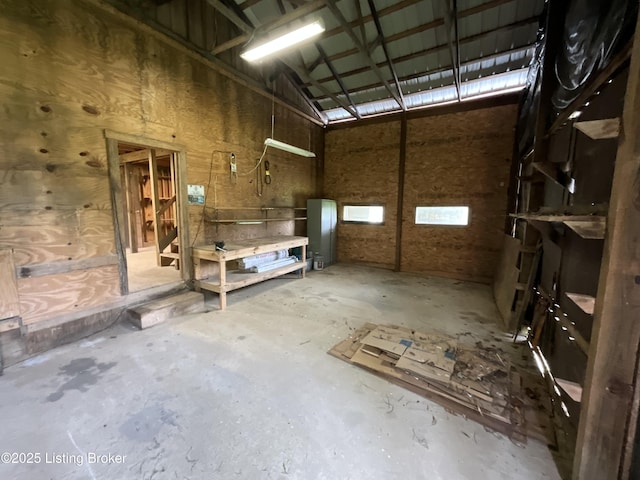 224 Spring Creek Ln, Milton, KY 40045 - interior space with concrete flooring, a high ceiling, and a garage