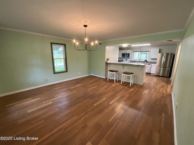 224 Spring Creek Ln, Milton, KY 40045 - unfurnished dining area with crown molding, a chandelier, and dark wood-type flooring