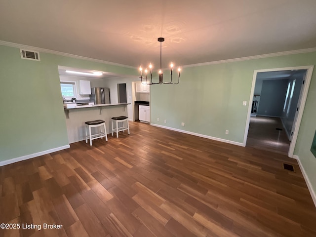 224 Spring Creek Ln, Milton, KY 40045 - dining space with dark wood-type flooring, visible vents, crown molding, and an inviting chandelier