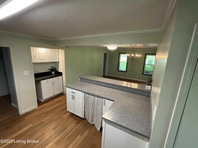 224 Spring Creek Ln, Milton, KY 40045 - kitchen with dark wood-style floors, white cabinetry, and ornamental molding
