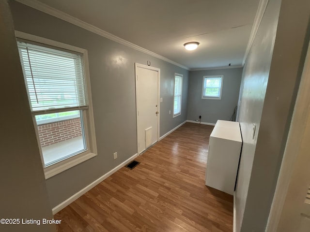 224 Spring Creek Ln, Milton, KY 40045 - foyer entrance featuring wood finished floors, visible vents, baseboards, and ornamental molding