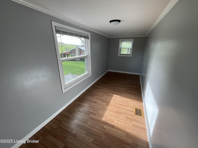 224 Spring Creek Ln, Milton, KY 40045 - spare room with dark wood finished floors, visible vents, baseboards, and ornamental molding