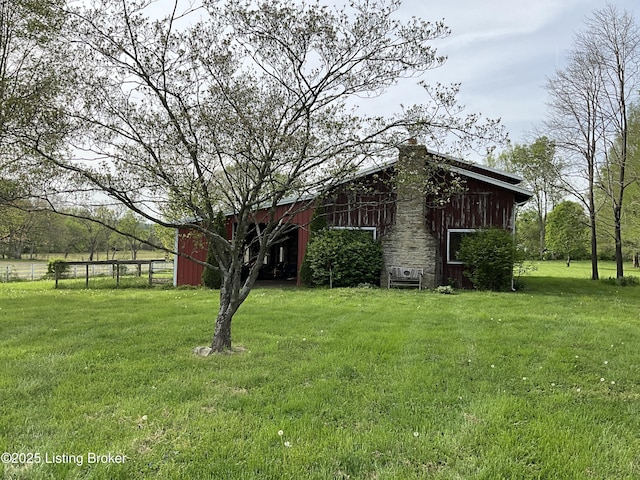 224 Spring Creek Ln, Milton, KY 40045 - view of home's exterior with a barn, a chimney, fence, an outdoor structure, and a yard