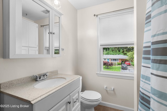 2807 Alice Ave, Louisville, KY 40220 - bathroom featuring vanity, toilet, tile patterned floors, curtained shower, and baseboards