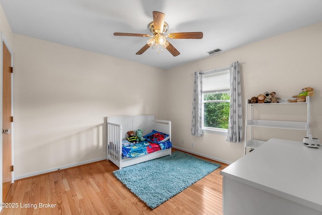 2807 Alice Ave, Louisville, KY 40220 - bedroom with light wood finished floors, baseboards, and a ceiling fan