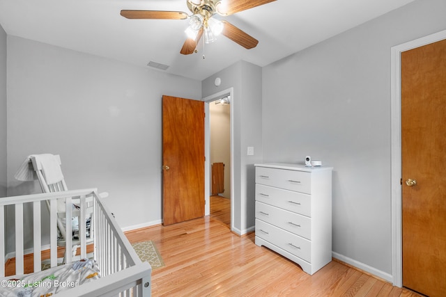 2807 Alice Ave, Louisville, KY 40220 - bedroom with light wood finished floors, baseboards, and ceiling fan