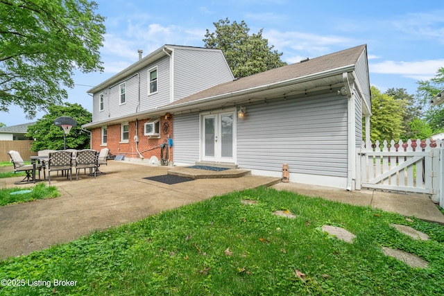 2807 Alice Ave, Louisville, KY 40220 - rear view of property with french doors, a patio area, and brick siding