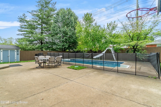 2807 Alice Ave, Louisville, KY 40220 - view of pool with a water slide, a fenced backyard, a patio, and an outbuilding