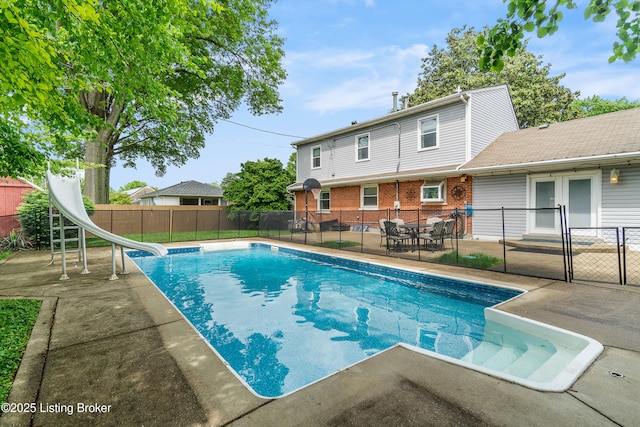 2807 Alice Ave, Louisville, KY 40220 - view of swimming pool with a water slide, a patio, a fenced backyard, and french doors