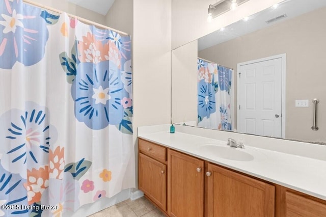 bathroom with a shower with curtain, vanity, tile patterned floors, and visible vents