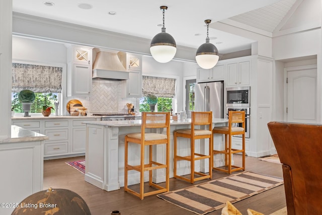 9790 Shelbyville Rd, Simpsonville, KY 40067 - kitchen with stainless steel appliances, light wood-style floors, custom exhaust hood, backsplash, and light countertops