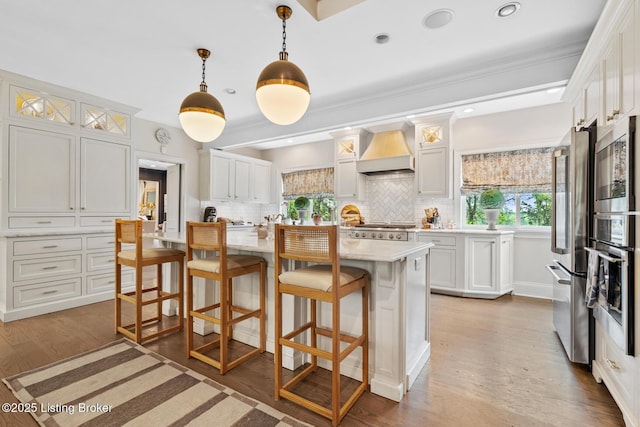 9790 Shelbyville Rd, Simpsonville, KY 40067 - kitchen featuring appliances with stainless steel finishes, a breakfast bar, custom exhaust hood, and backsplash