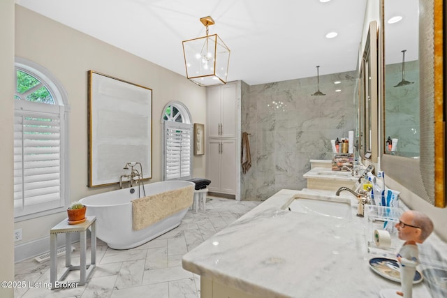 9790 Shelbyville Rd, Simpsonville, KY 40067 - bathroom with recessed lighting, a freestanding bath, marble finish floor, vanity, and a marble finish shower