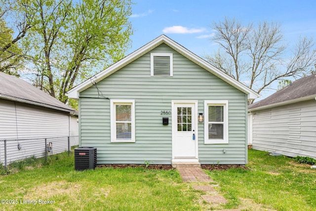 2550 Broadway St, New Albany, IN 47150 - back of house featuring a lawn, central AC, and fence