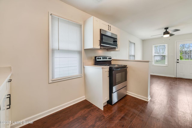 2550 Broadway St, New Albany, IN 47150 - kitchen featuring dark wood finished floors, baseboards, and appliances with stainless steel finishes