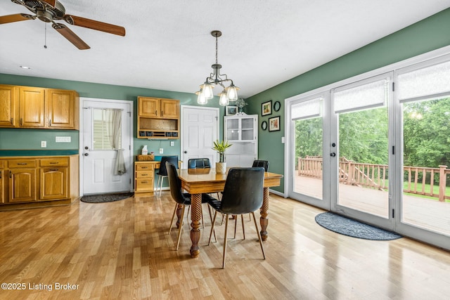 5502 Highpoint Dr, Crestwood, KY 40014 - dining space with light wood-style flooring, ceiling fan, and a chandelier