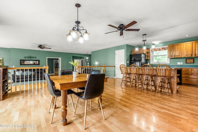 5502 Highpoint Dr, Crestwood, KY 40014 - dining area featuring a ceiling fan, light wood-type flooring, and a chandelier