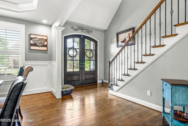 10905 Rock Valley Ct, Louisville, KY 40241 - foyer with arched walkways, french doors, wood-type flooring, stairs, and wainscoting