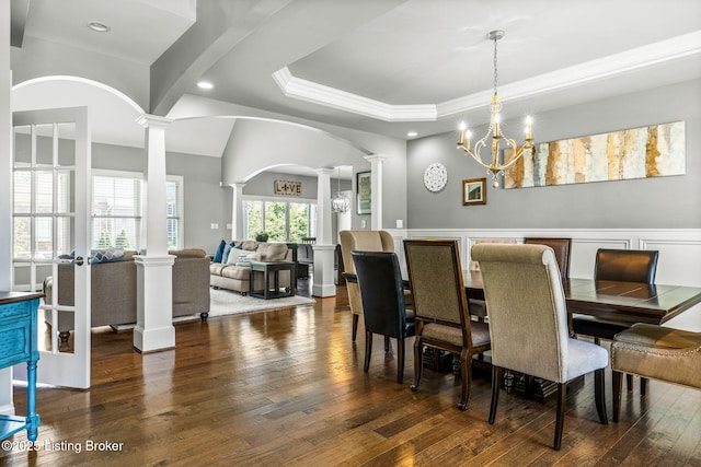 10905 Rock Valley Ct, Louisville, KY 40241 - dining space featuring ornate columns, arched walkways, hardwood / wood-style floors, ornamental molding, and a chandelier