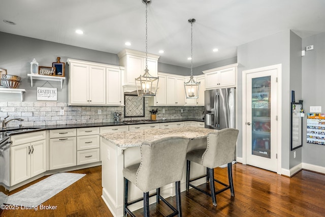 10905 Rock Valley Ct, Louisville, KY 40241 - kitchen with a sink, decorative backsplash, dark wood-type flooring, hanging light fixtures, and recessed lighting