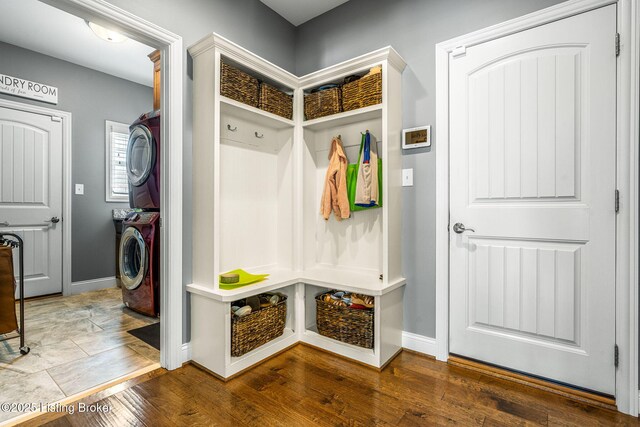 10905 Rock Valley Ct, Louisville, KY 40241 - mudroom with stacked washer / dryer, baseboards, and wood finished floors