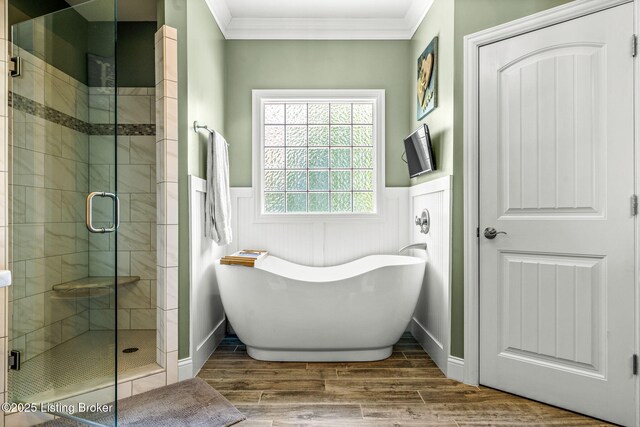 10905 Rock Valley Ct, Louisville, KY 40241 - bathroom with ornamental molding, a shower stall, a freestanding bath, a wainscoted wall, and wood finished floors