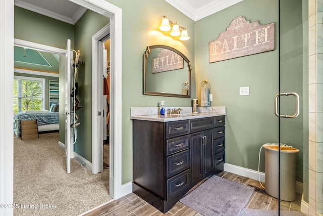 10905 Rock Valley Ct, Louisville, KY 40241 - ensuite bathroom with crown molding, baseboards, wood finish floors, vanity, and a shower with shower door