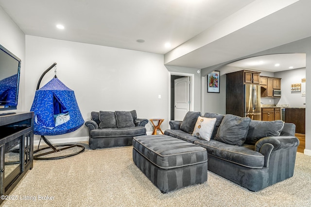 10905 Rock Valley Ct, Louisville, KY 40241 - living room featuring arched walkways, carpet flooring, recessed lighting, and baseboards