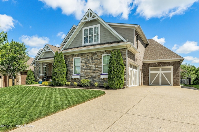 10905 Rock Valley Ct, Louisville, KY 40241 - view of front of property with concrete driveway, a garage, a front lawn, stone siding, and a shingled roof