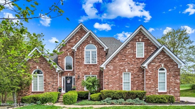 traditional home with brick siding