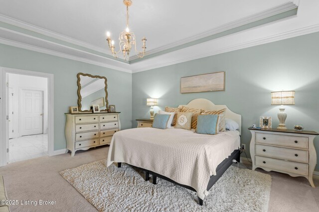 bedroom featuring carpet, a tray ceiling, ornamental molding, baseboards, and a notable chandelier