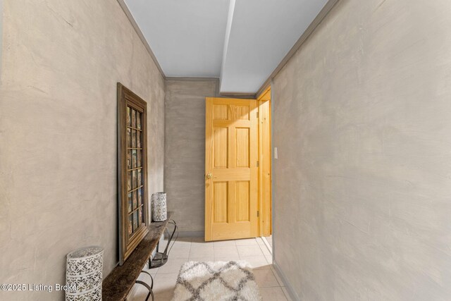 hall with tile patterned flooring