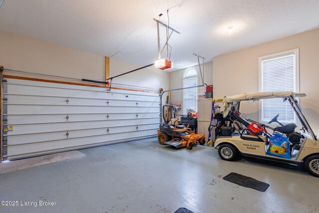 garage featuring a garage door opener