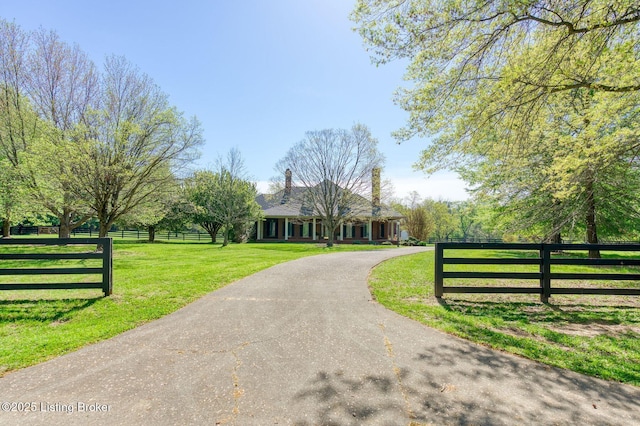 2605 Evergreen Wynde, Louisville, KY 40223 - view of front of property featuring fence, aphalt driveway, and a front yard