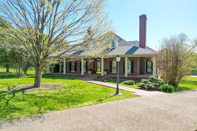 2605 Evergreen Wynde, Louisville, KY 40223 - view of front of home with a front lawn, covered porch, and brick siding