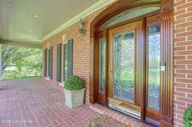2605 Evergreen Wynde, Louisville, KY 40223 - doorway to property with covered porch and brick siding