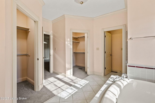 2605 Evergreen Wynde, Louisville, KY 40223 - interior space with crown molding, a closet, baseboards, light tile patterned flooring, and a walk in closet