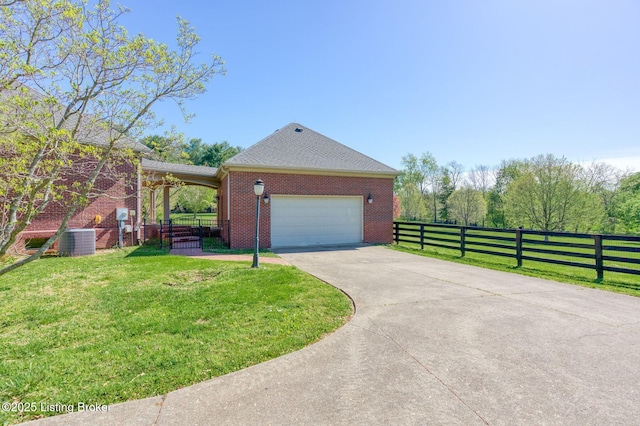 2605 Evergreen Wynde, Louisville, KY 40223 - view of property exterior with a yard, cooling unit, driveway, brick siding, and fence
