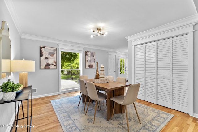 1907 Charbdin Pl, Louisville, KY 40207 - dining area with ornamental molding, baseboards, light wood-style floors, and arched walkways