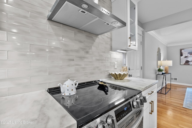 1907 Charbdin Pl, Louisville, KY 40207 - kitchen featuring ventilation hood, stainless steel range with electric stovetop, ornamental molding, baseboards, and white cabinets