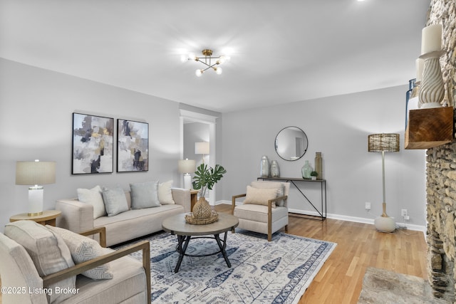1907 Charbdin Pl, Louisville, KY 40207 - living room with wood finished floors, baseboards, and a chandelier