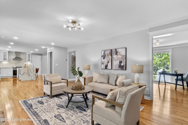 1907 Charbdin Pl, Louisville, KY 40207 - living room featuring light wood-type flooring, recessed lighting, a chandelier, and baseboards