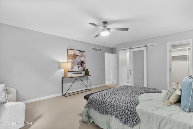 1907 Charbdin Pl, Louisville, KY 40207 - bedroom featuring carpet flooring, baseboards, a barn door, and a spacious closet