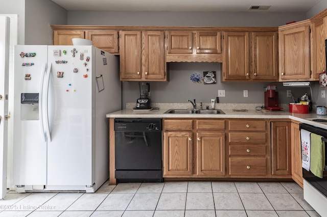 kitchen with visible vents, white appliances, light countertops, and a sink