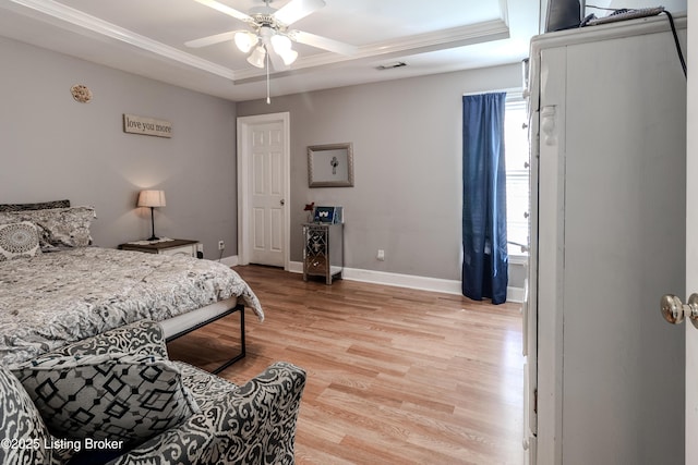 bedroom featuring visible vents, light wood-type flooring, multiple windows, and baseboards